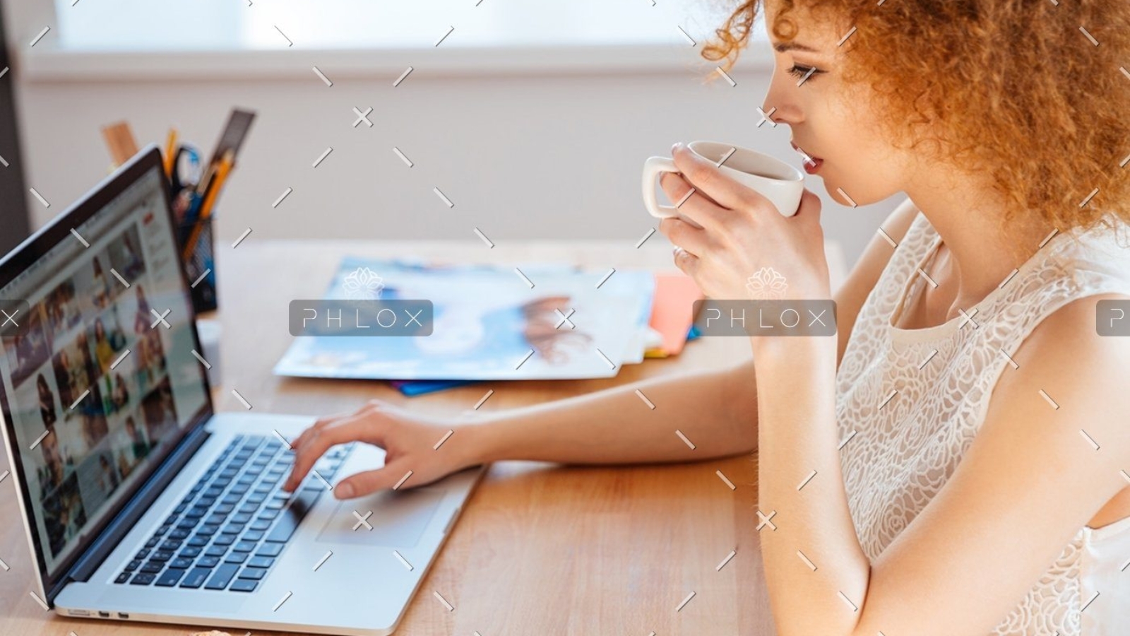 demo-attachment-218-woman-photographer-drinking-coffee-and-working-PJNBP6U@2x